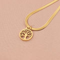 Gold tone lucky tree pendant necklace on a textured snake chain against a plain background.