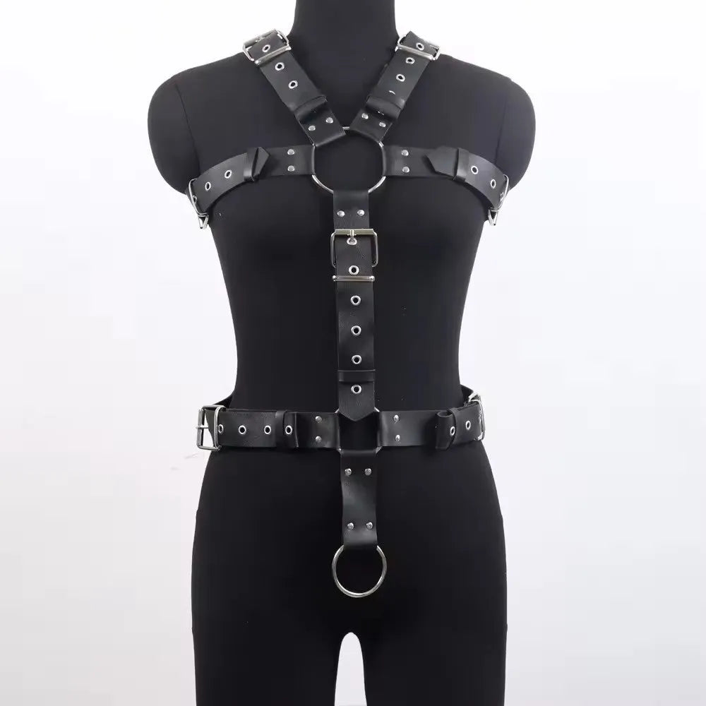 Thin black patent leather shapewear belt with a silver-tone pin buckle on a mannequin waist.