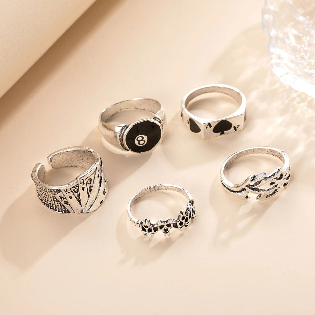 Black alloy ring with a raised retro spade card design on top.