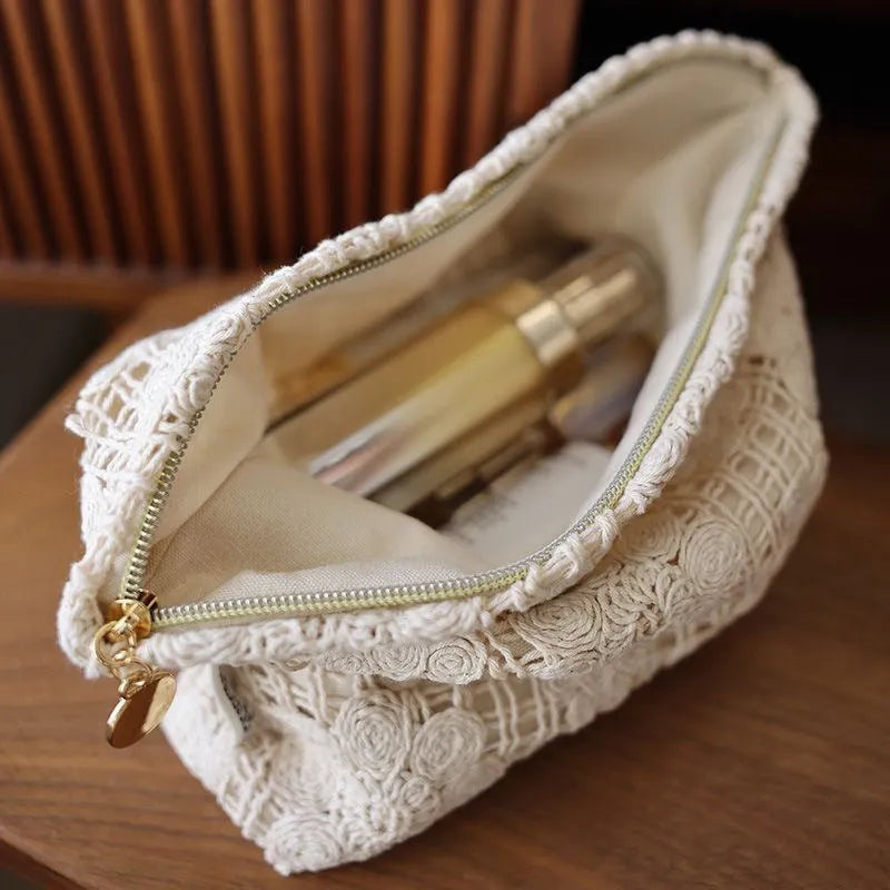 Handmade corduroy cosmetic bag with crocheted hollow flowers and ethnic embroidery, rope handle