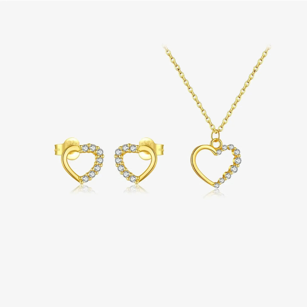 Sterling silver hollow heart pendant necklace on a classic chain, available in white gold or 18K gold plating.