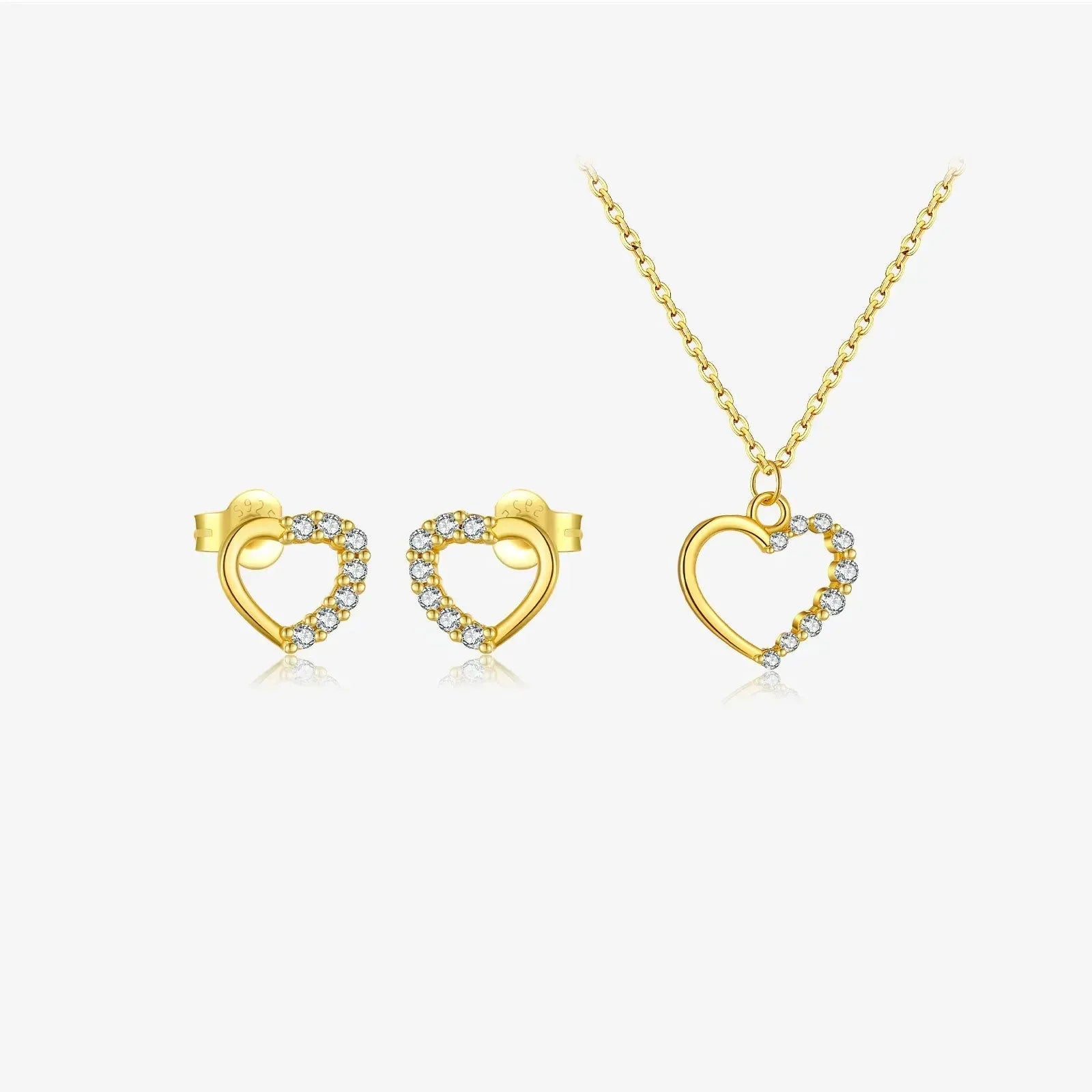 Sterling silver hollow heart pendant necklace on a classic chain, available in white gold or 18K gold plating.