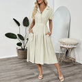 Light green women's twill shirt dress with lapel collar, waist tie, and a pocket.