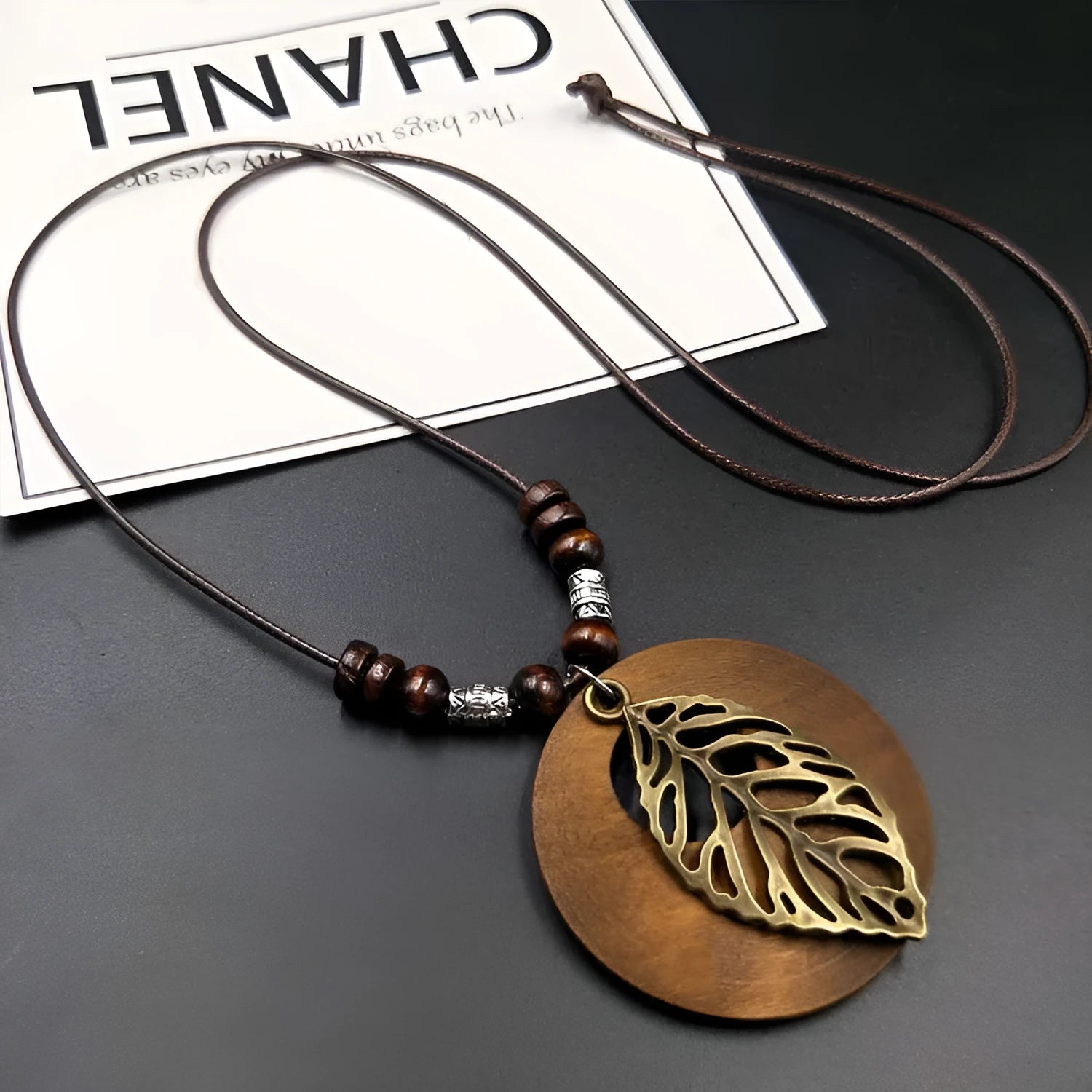 Green wooden leaf pendant necklace on adjustable wax cord chain with ethnic style design