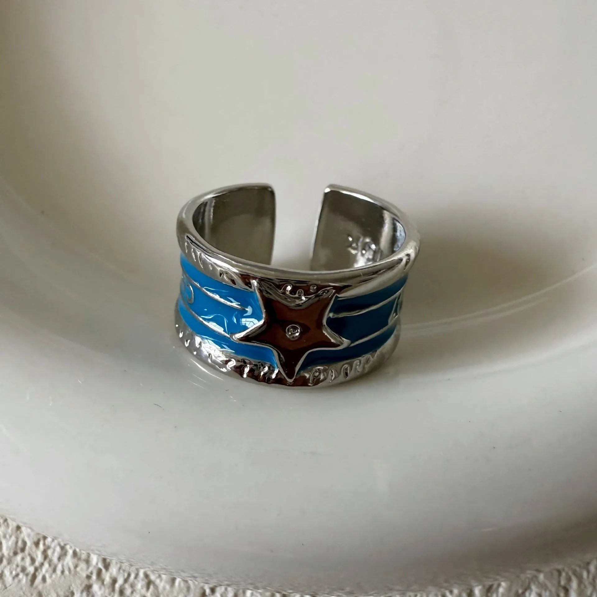 Retro geometric copper ring with adjustable sizing and a distressed finish.