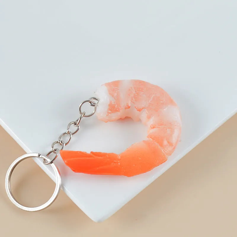 Modern minimalist PVC shrimp-shaped keychain with 1.5cm thickness.