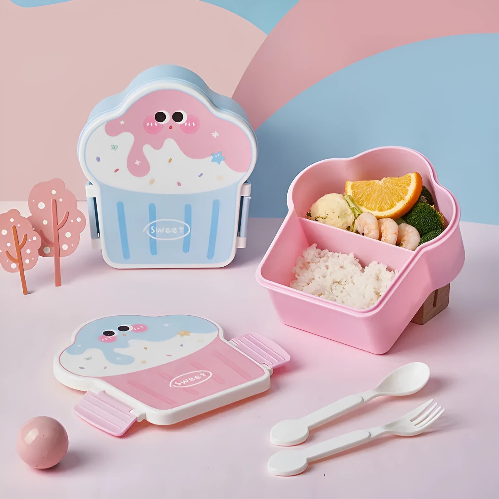 Pink and blue creative ice cream shaped plastic bento lunch box with included spoon and fork.