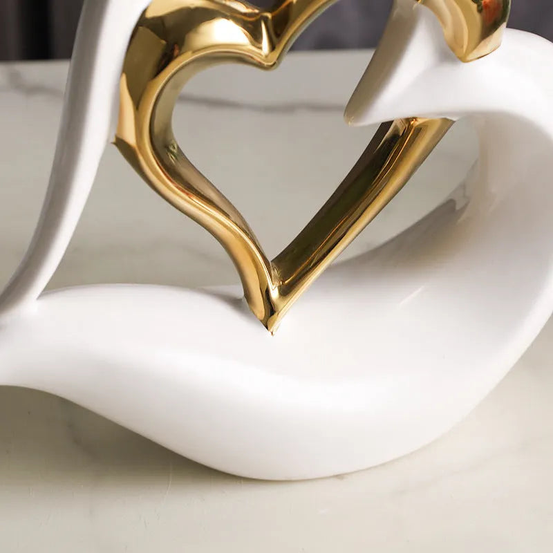 Modern white porcelain love heart ornament with geometric style on a table.