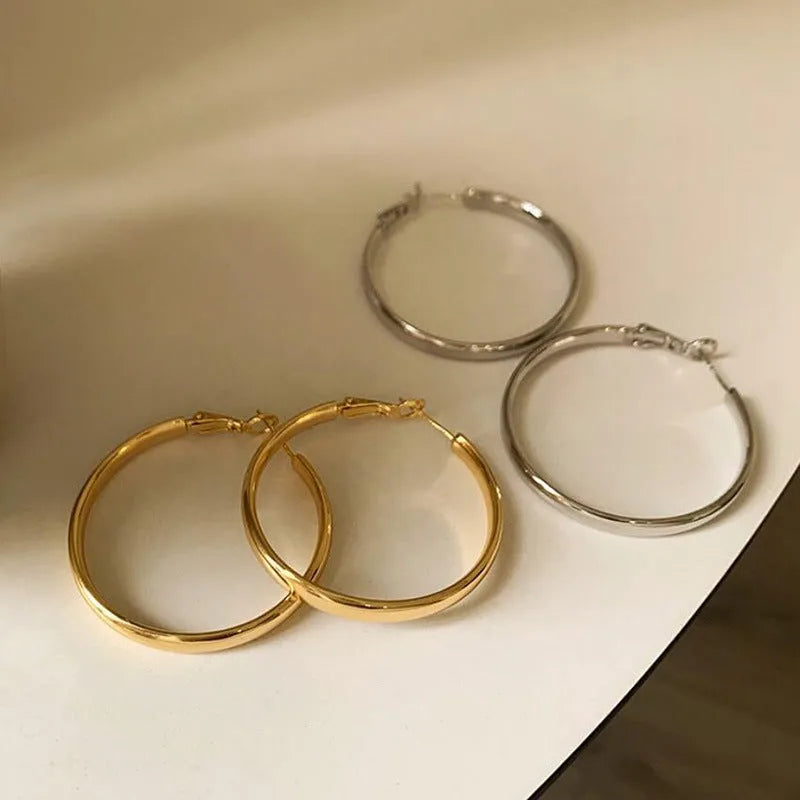 40mm circular metal earrings with electroplated gold or silver finish on copper base