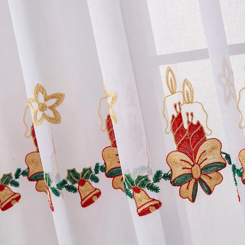 Christmas curtains with white snowflake embroidery on red polyester fabric hanging in window