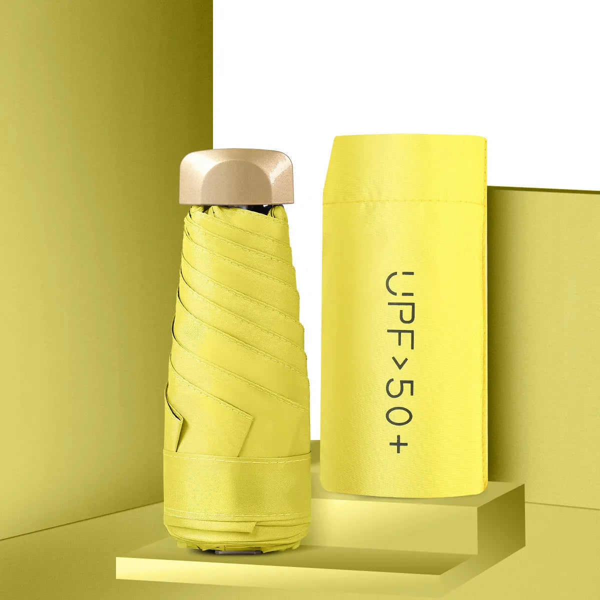 Five-fold mini pocket sun umbrella with rubber handle shown in open position