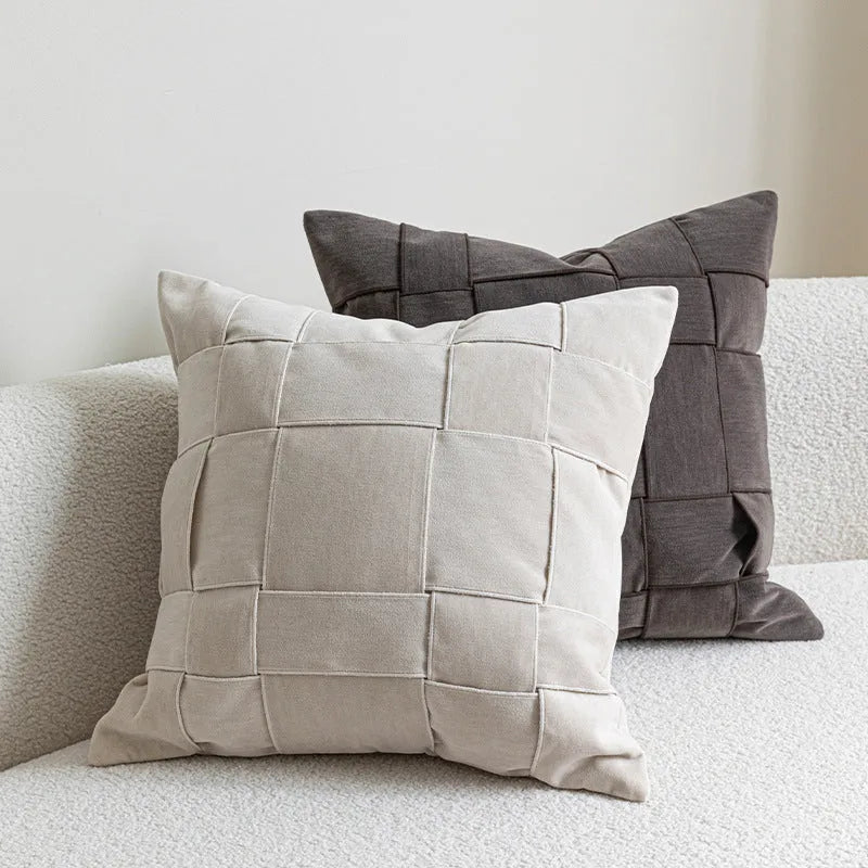Square chenille woven cushion in beige colour showing textured surface