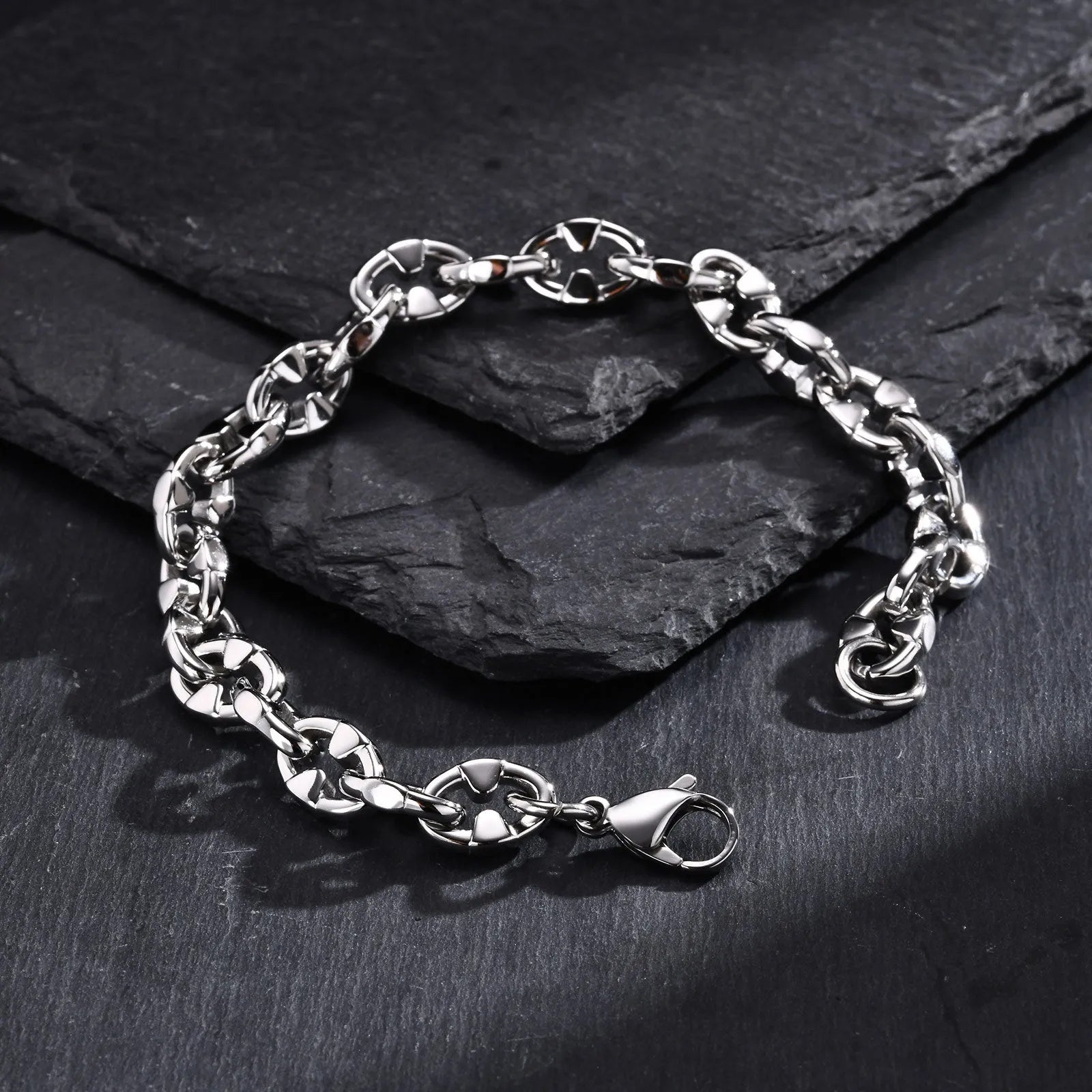 Men's stainless steel geometric link chain bracelet showing thick handmade construction