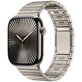 Silver stainless steel Apple Watch strap with magnetic buckle on a wrist