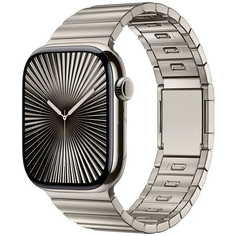 Silver stainless steel Apple Watch strap with magnetic buckle on a wrist