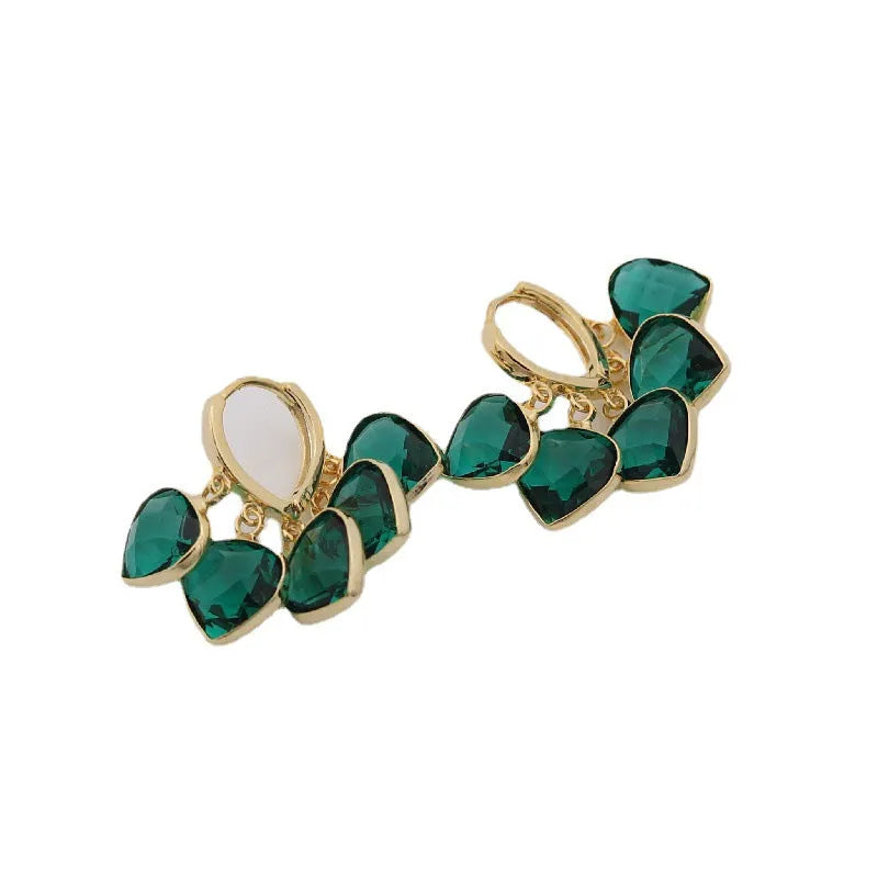 Pair of green heart-shaped glass pendant ear clip earrings with alloy and artificial gemstone details.