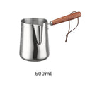Stainless steel barista milk jug with measurement scale and wooden handle shown in 350ml, 600ml, and 1000ml sizes.