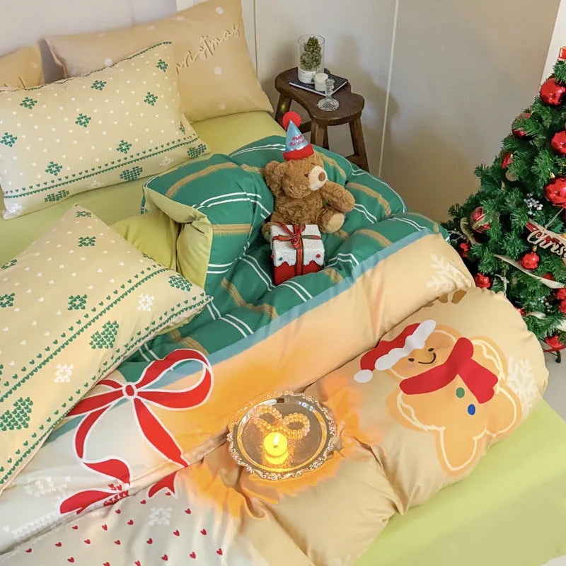 Christmas cartoon print bedding four-piece set showing sheet, duvet cover, and pillowcases.