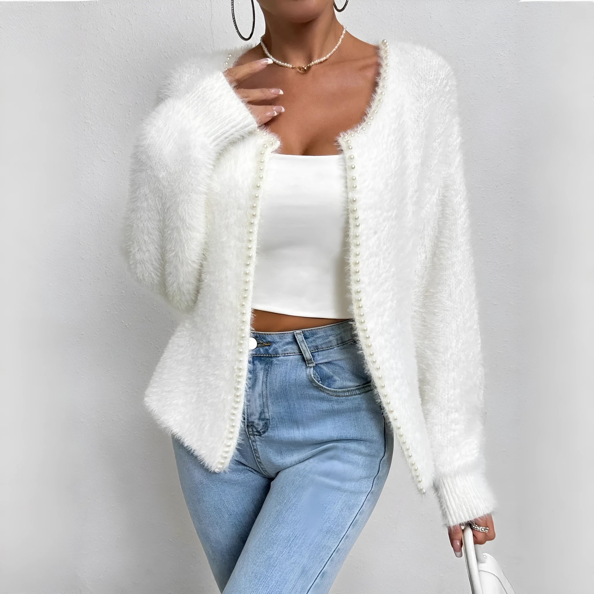 White women's V-neck cardigan with bead details, shown as a knitwear coat.