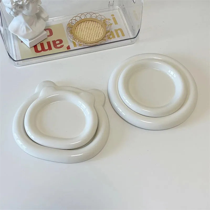 White ceramic plate with bear doodle design, 20cm diameter, on a table.