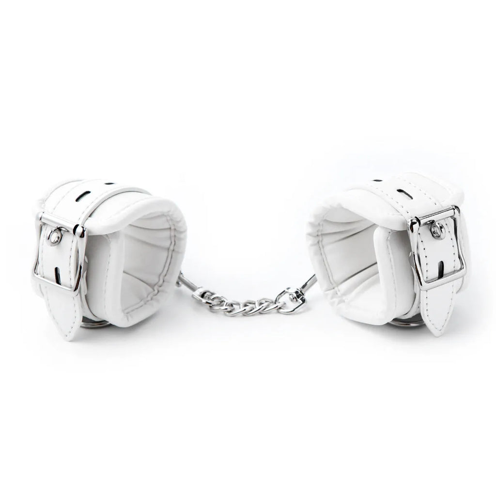 White PU sponge bondage restraint set showing wrist cuffs, ankle cuffs and neck cuff