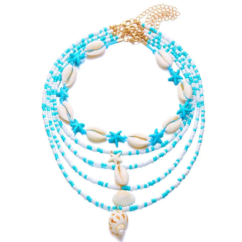 Five women's necklaces with starfish, shell and conch bead pendants on adjustable chains