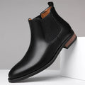 Men's black Chelsea boots with round toe, low heel, and mid-calf shaft made from artificial PU leather