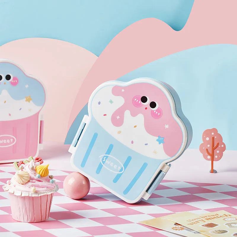 Pink and blue creative ice cream shaped plastic bento lunch box with included spoon and fork.