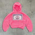 Unisex black hoodie zipper jacket with white letter print and kangaroo pockets, modelled in a loose fit.