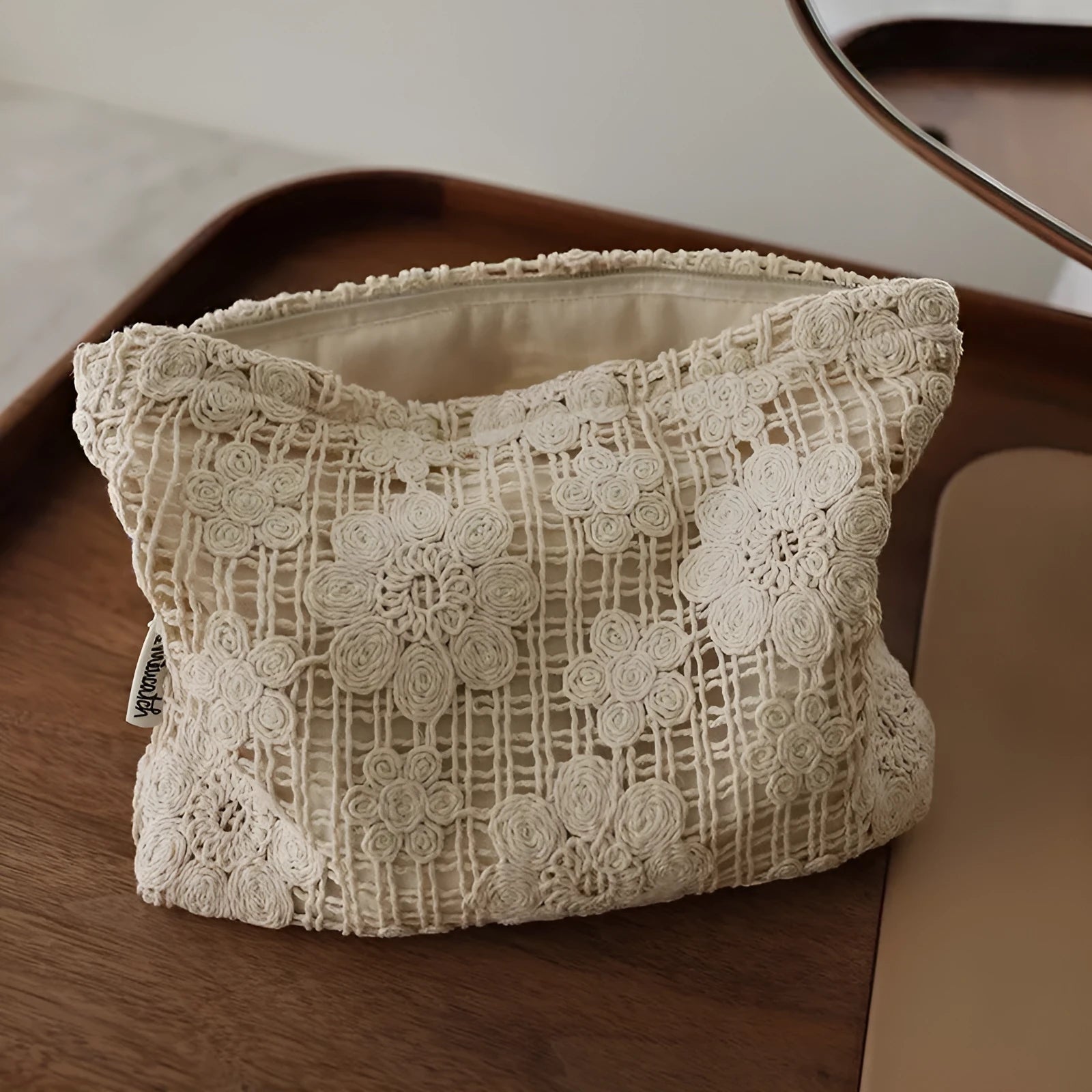 Handmade corduroy cosmetic bag with crocheted hollow flowers and ethnic embroidery, rope handle