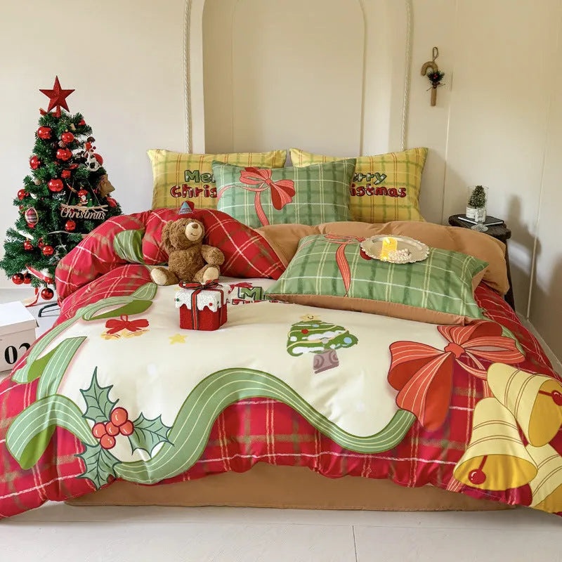 Christmas cartoon print bedding four-piece set showing sheet, duvet cover, and pillowcases.