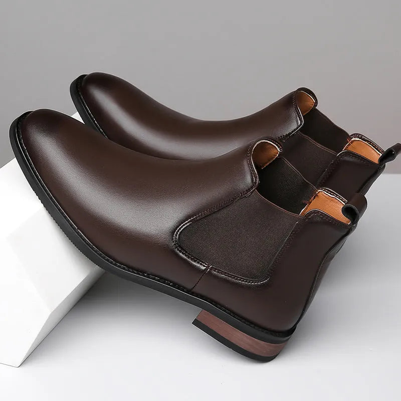 Men's black Chelsea boots with round toe, low heel, and mid-calf shaft made from artificial PU leather