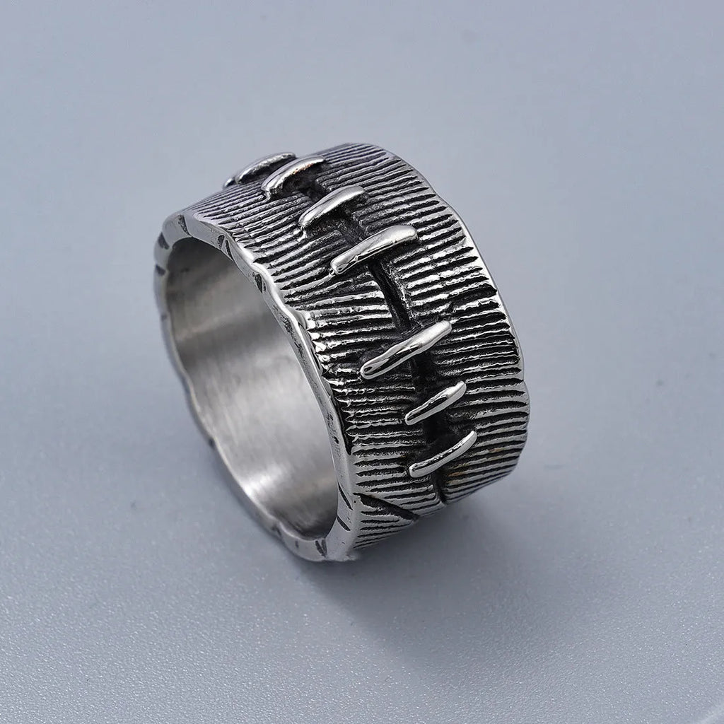 Geometric titanium steel double ring with U-shape design in retro colour on a hand.