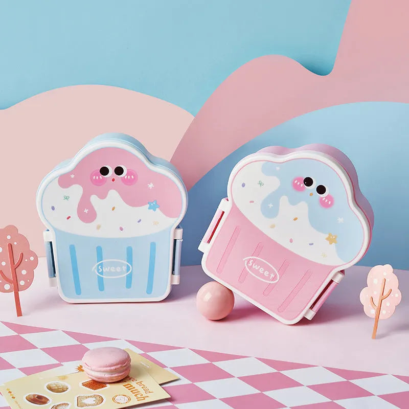 Pink and blue creative ice cream shaped plastic bento lunch box with included spoon and fork.