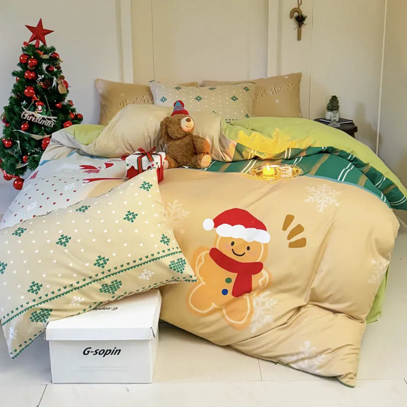 Christmas cartoon print bedding four-piece set showing sheet, duvet cover, and pillowcases.