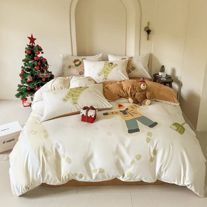 Christmas cartoon print bedding four-piece set showing sheet, duvet cover, and pillowcases.