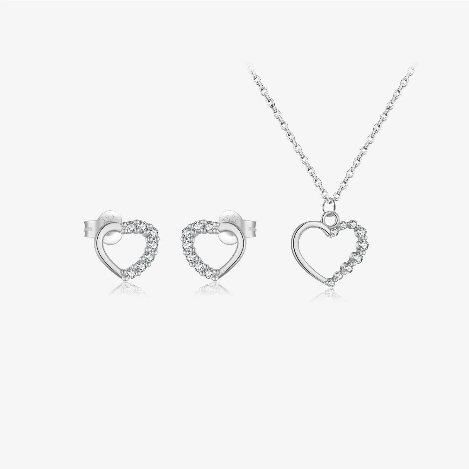 Sterling silver hollow heart pendant necklace on a classic chain, available in white gold or 18K gold plating.