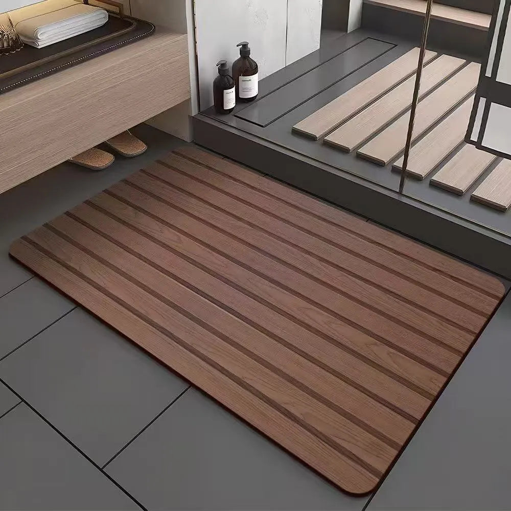 American-style square bath mat with wood grain pattern on a bathroom floor.
