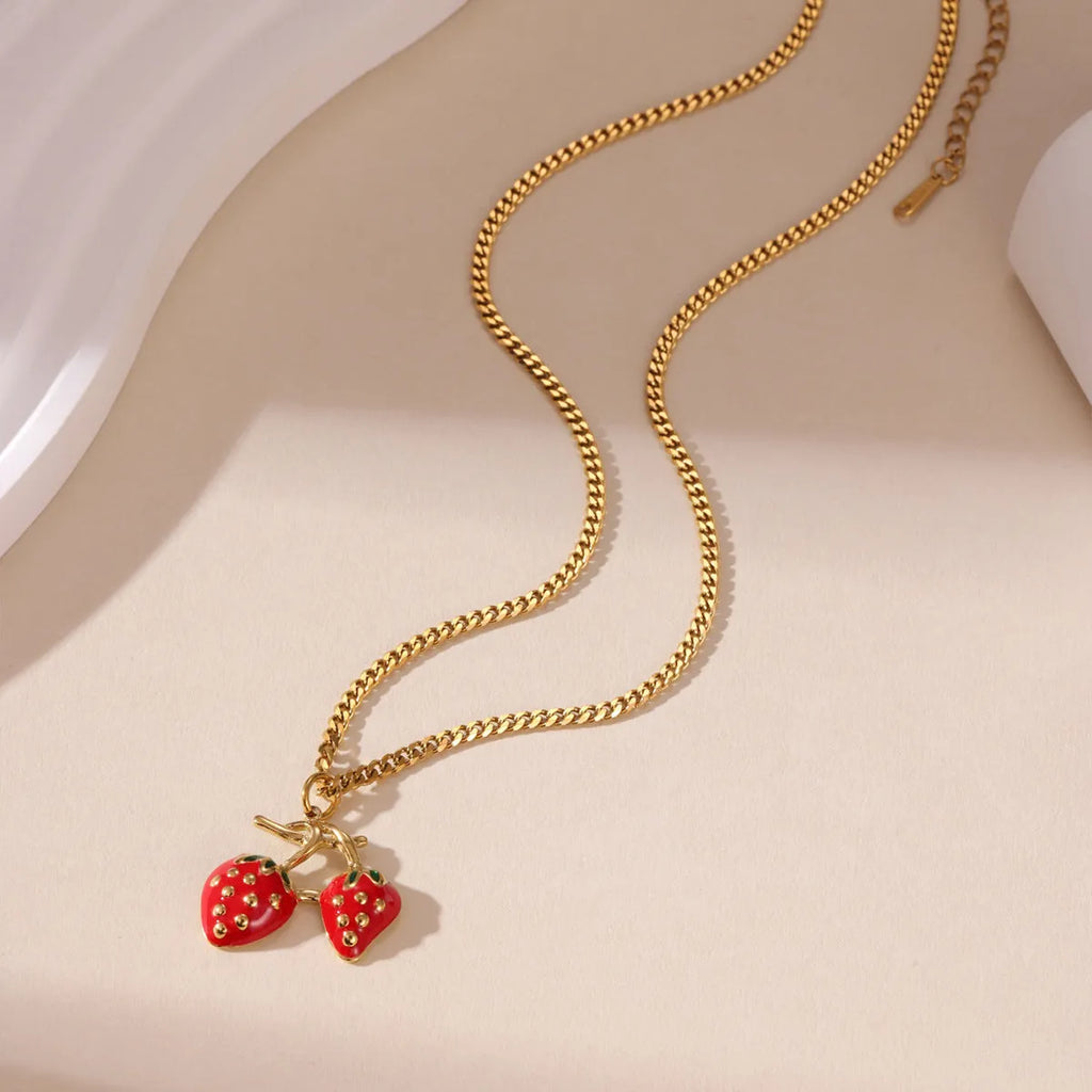 Stainless steel strawberry pendant necklace with red and white gradient colour finish.