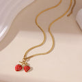 Stainless steel strawberry pendant necklace with red and white gradient colour finish.