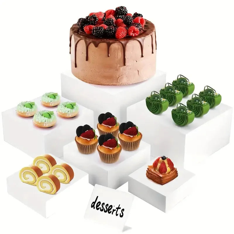 White and transparent plastic dessert display cube sets showing stackable 6-piece arrangements for cakes and pastries