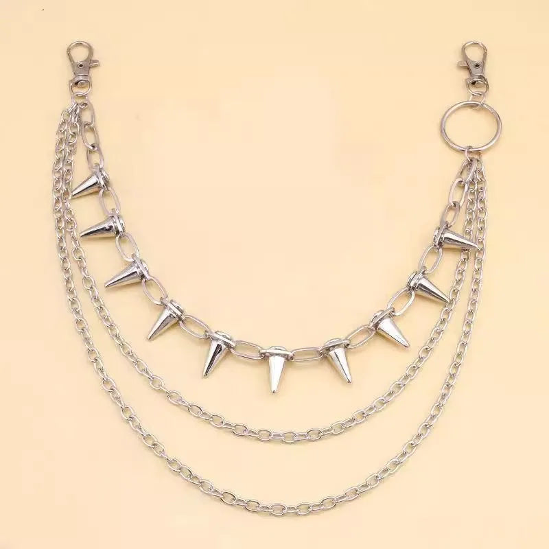 Silver metal pants chain with double layer design and punk rivet ornaments on dark background