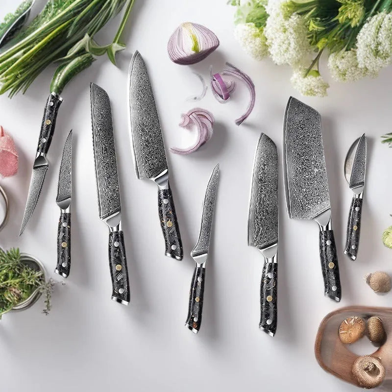 Damascus steel eight-piece kitchen knife set showing fishbone pattern on blades, including fruit, steak, boning, and chef's knives.