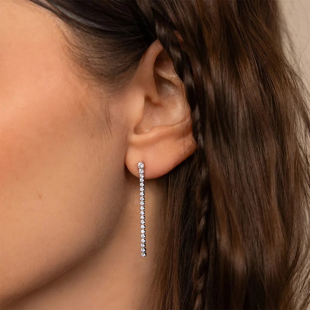 Geometric line design stainless steel earrings with zircon stones in gold and steel colour options.