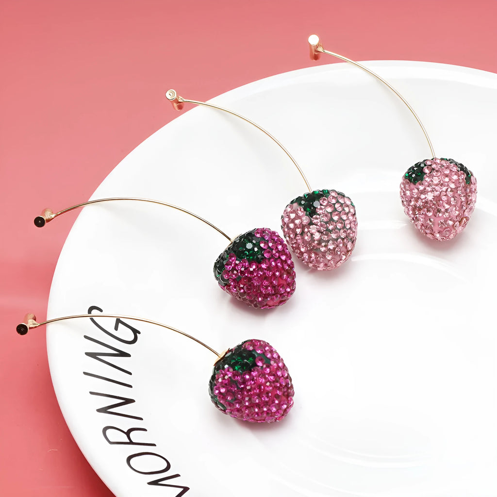 Geometric strawberry-shaped alloy earrings with spot-drill texture, shown in red colour.