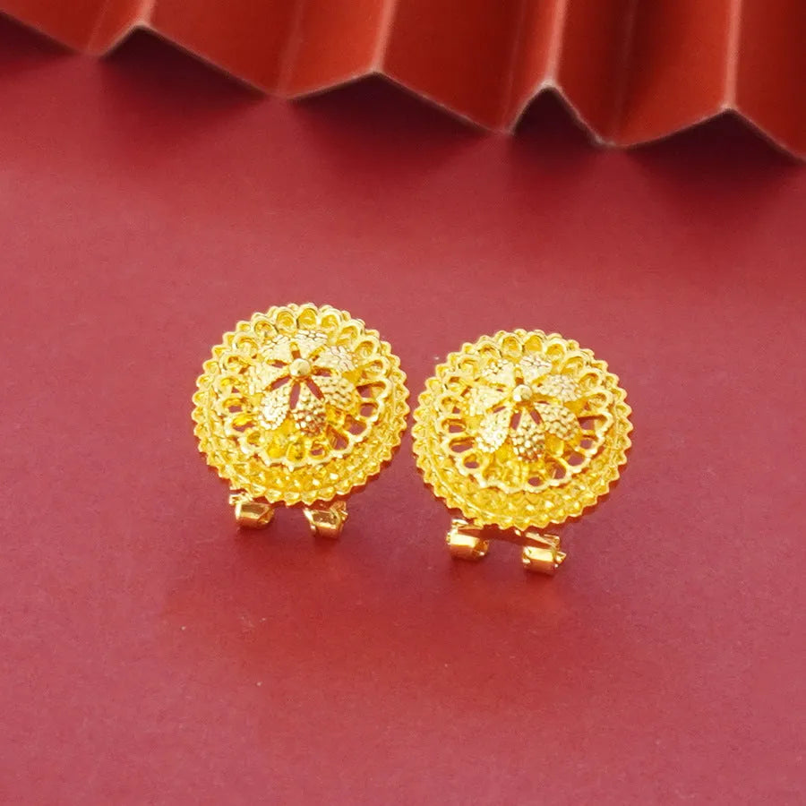 Gold-plated three-piece jewellery set with floral designs including necklace, earrings, and ring