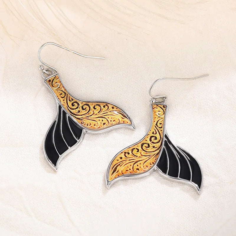 Women's fishtail earrings with whale motif in white gold colour retro style design