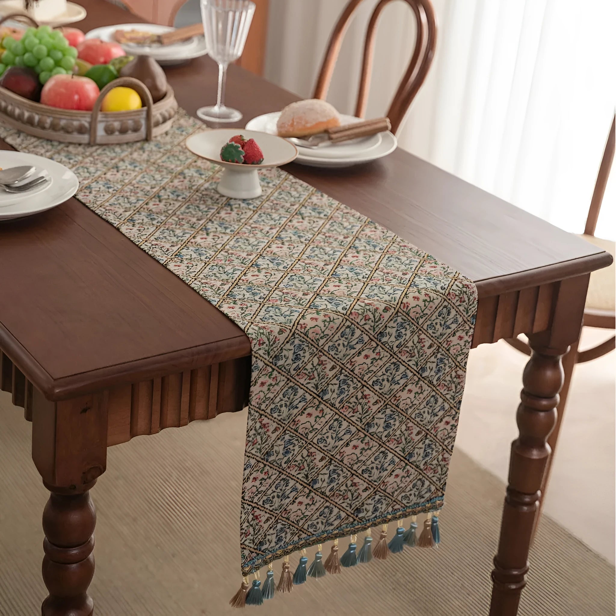 Dark blue Nordic Jacquard bouquet pattern table runner with tassel trim, 32cm wide.