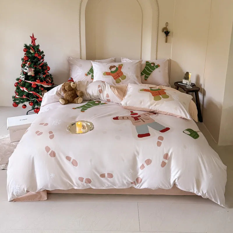 Christmas cartoon print bedding four-piece set showing sheet, duvet cover, and pillowcases.