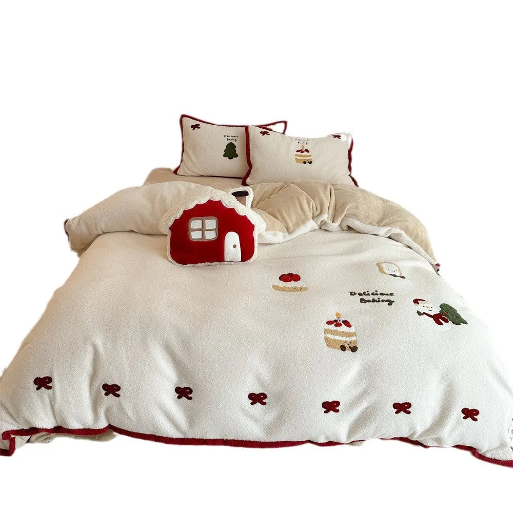 Cartoon winter-themed children's bedding four-piece set with duvet cover, sheet, and pillowcases.
